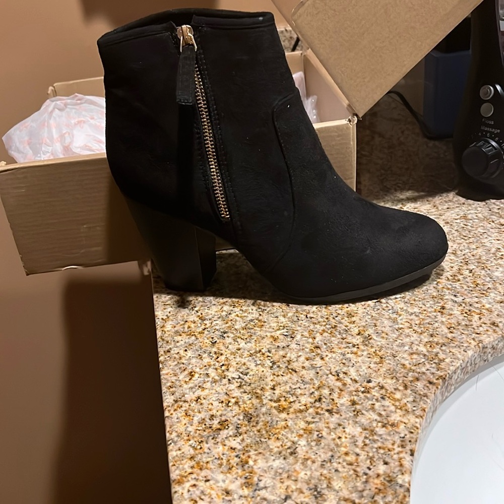 Black booties , never worn brand new
